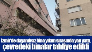 İzmir'de dayanıksız bina yıkım sırasında yan yattı, çevredeki binalar tahliye edildi